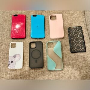 Mixed Lot of 7 I-Phone cases. Black, Red, Blue, Pink, White, And Black.